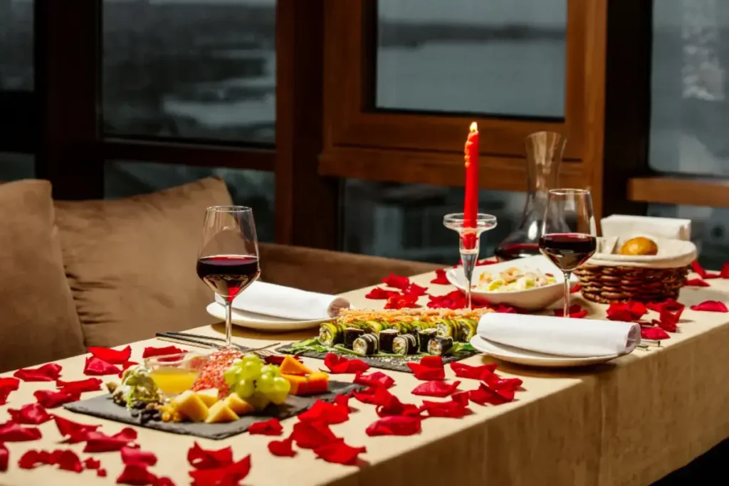 a romantic dinner table with candles and wine