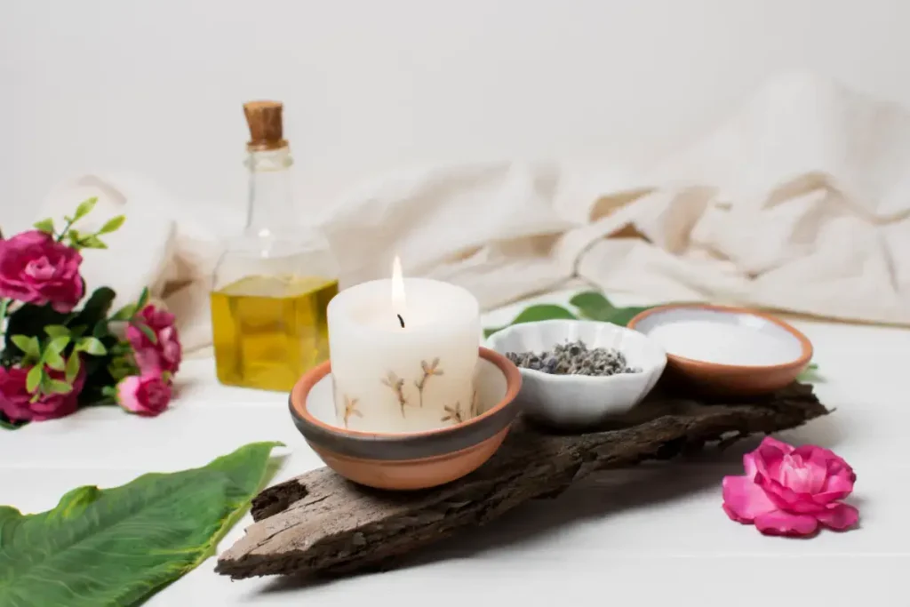 essential oils or flower near candlelight