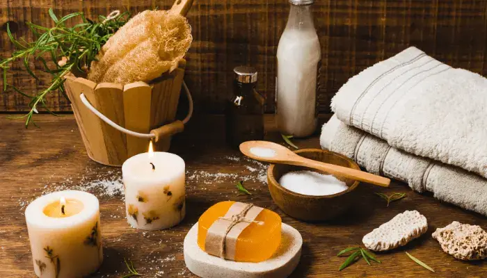 Home spa setup with candles and towels